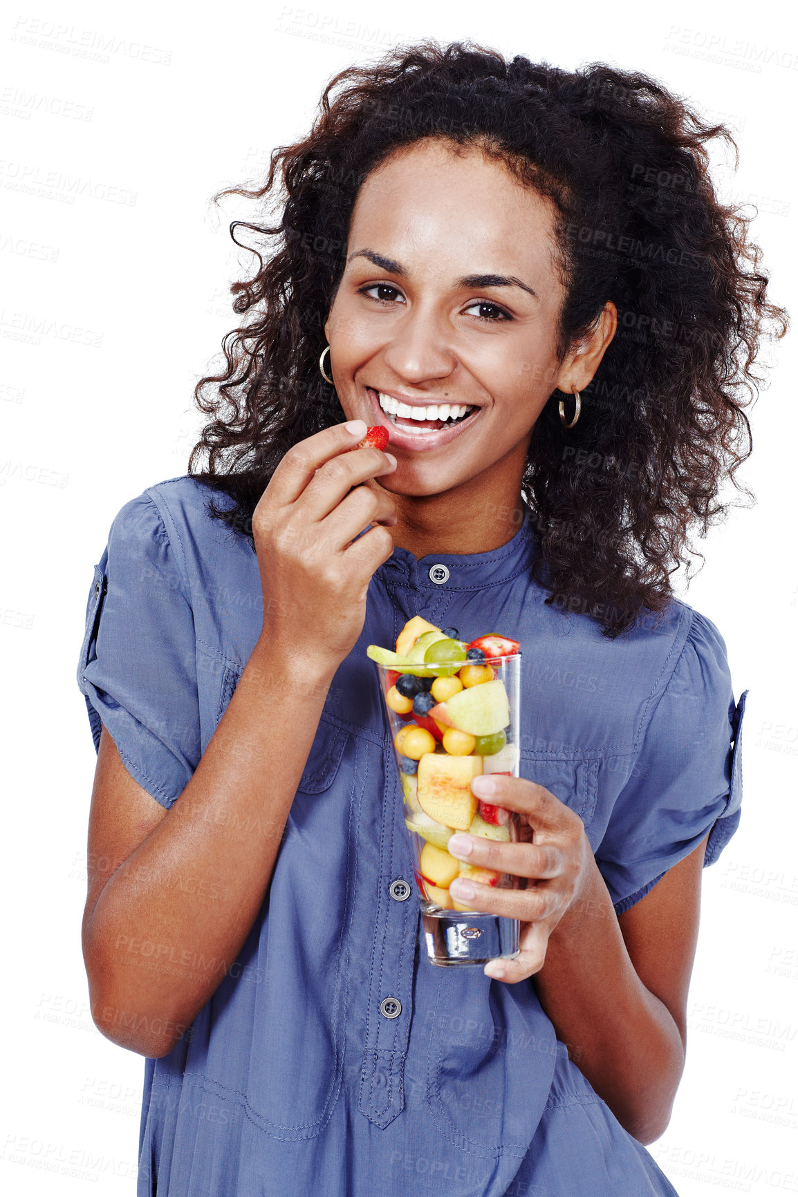 Buy stock photo Studio portrait of a smiling woman eating fruit salad isolated on white