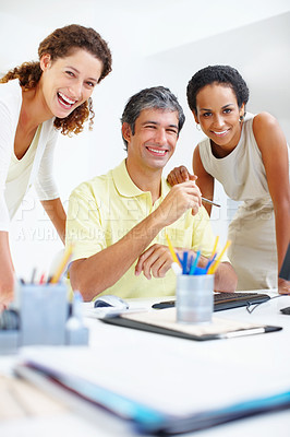 Buy stock photo Portrait of business people sitting at a table and giving you an attractive smile
