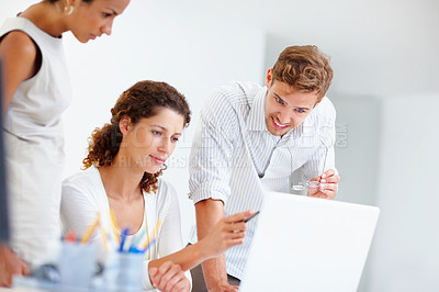 Buy stock photo Laptop, pointing and thinking with business people in office together for programming or web development. Collaboration, computer and planning with developer team in creative workplace for meeting