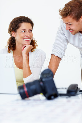 Buy stock photo Happy business people looking at each other with camera and laptop on table