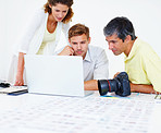 Photographers working on laptop