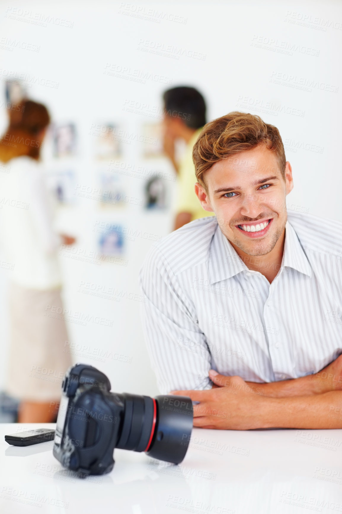 Buy stock photo Portrait, photographer and man with camera in office, confident and journalist with ambition in business. Proud, reporter and excited for internship in newsroom, happy and storytelling of person