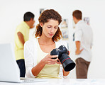 Woman checking out images in camera