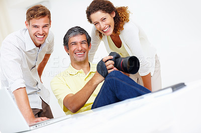 Buy stock photo Portrait of three professional photographers smiling