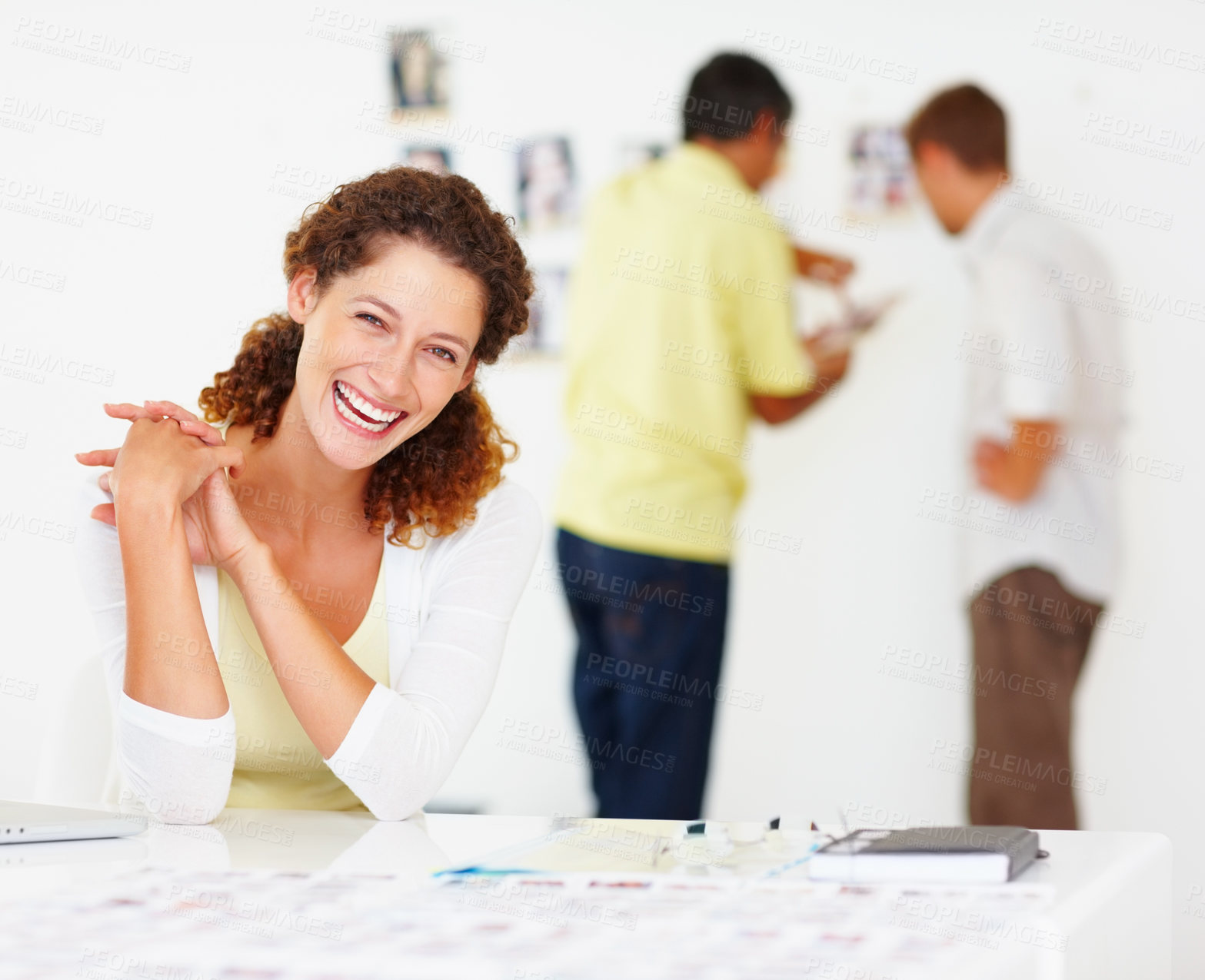 Buy stock photo Portrait of pretty business woman sitting at table and smiling with colleagues in background