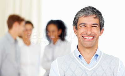 Buy stock photo Portrait of smiling business man with colleagues in background