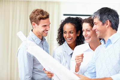 Buy stock photo Group of business architects in discussion with blueprint