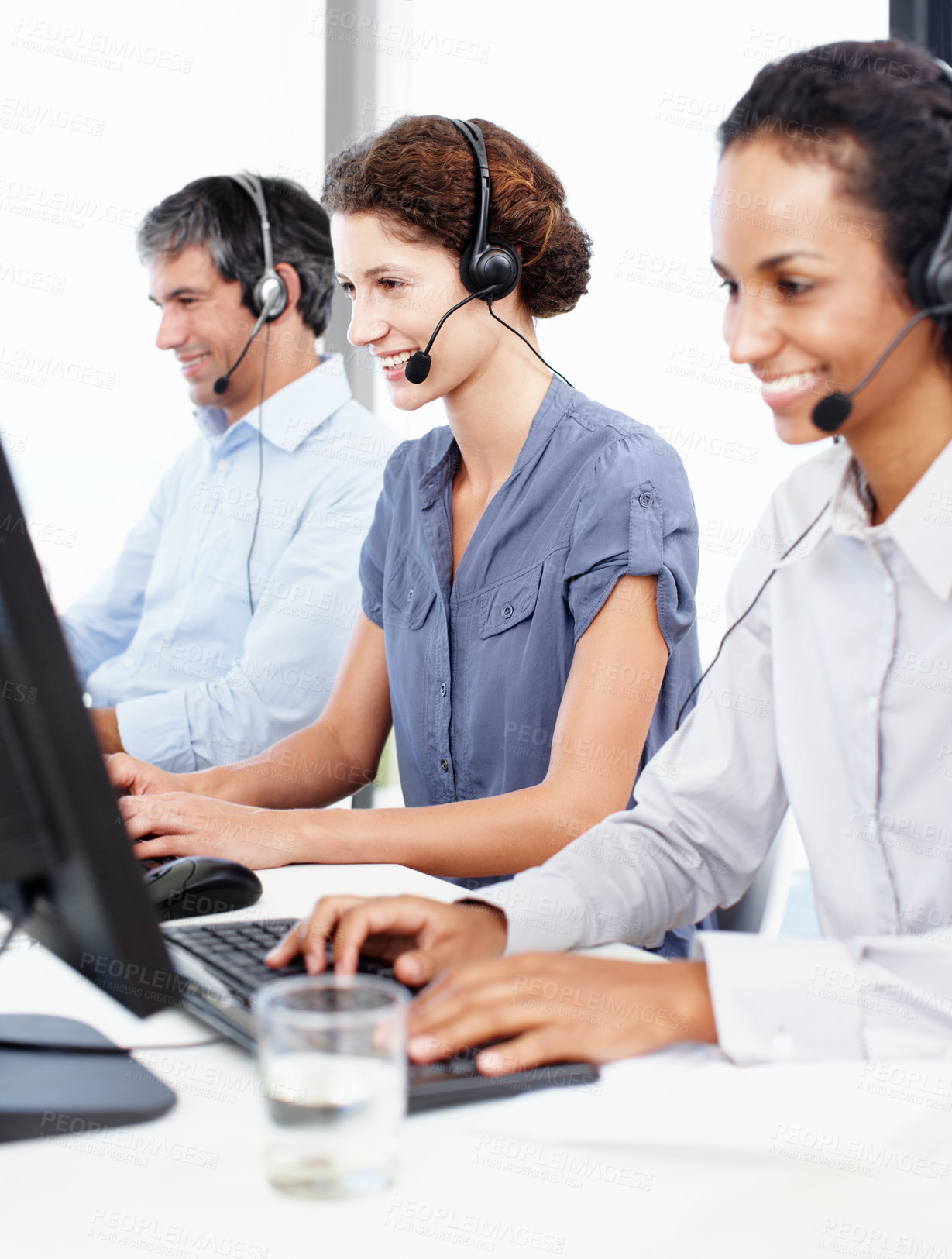 Buy stock photo Team, headset and smile in call center for customer service, telemarketing and diversity in office. Consultant, people or happy at help desk with contact, sales or technical support with tech for FAQ