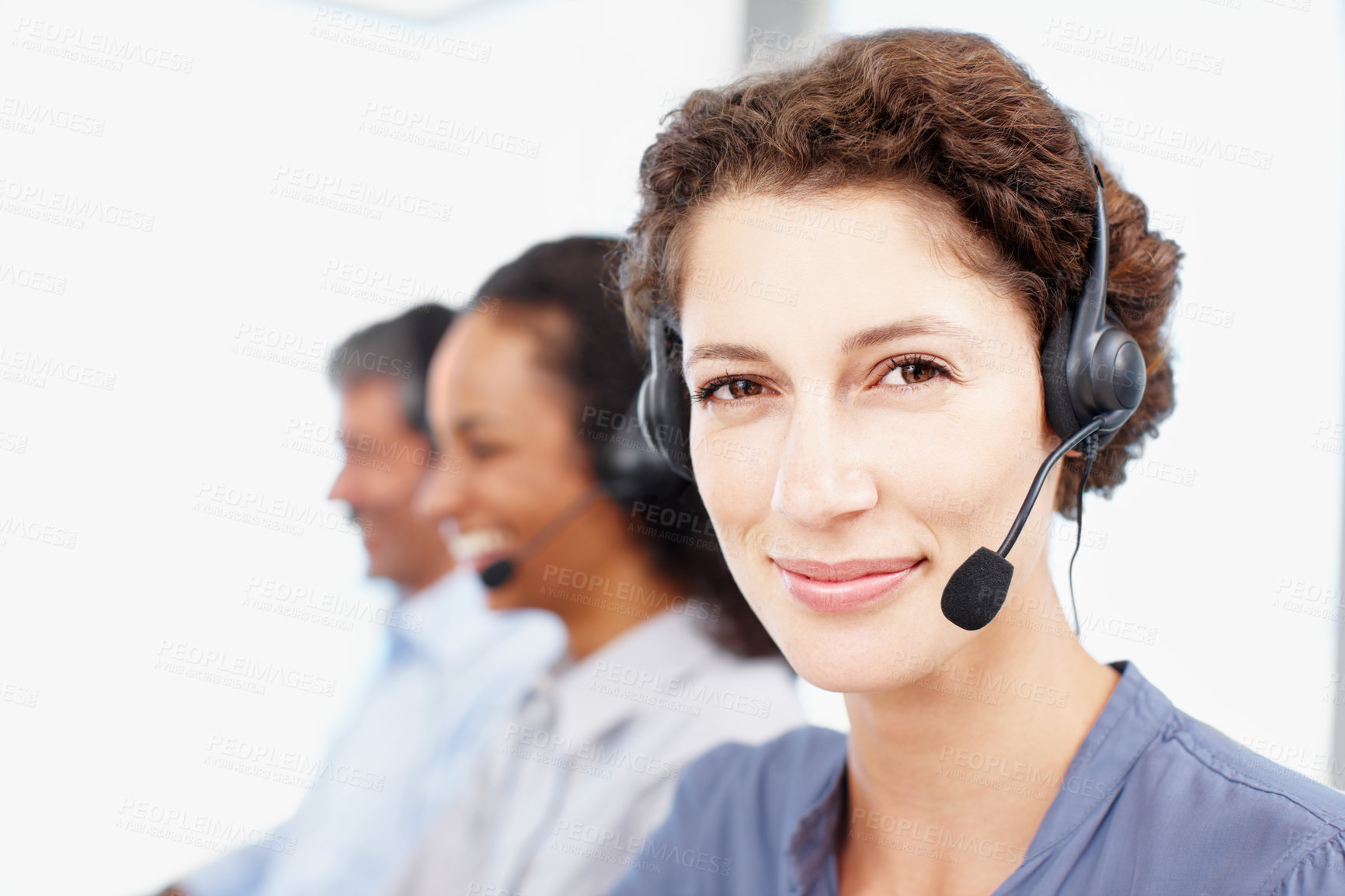 Buy stock photo Woman, portrait and smile in call center for customer support, contact us and CRM in office. Female consultant, face or headset at help desk with team, communication or telemarketing with tech