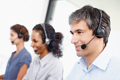 Buy stock photo Profile shot of a group of call center professionals working at their computers