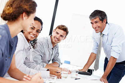 Buy stock photo Shot of a group of business people having a brainstorming session in a boardroom