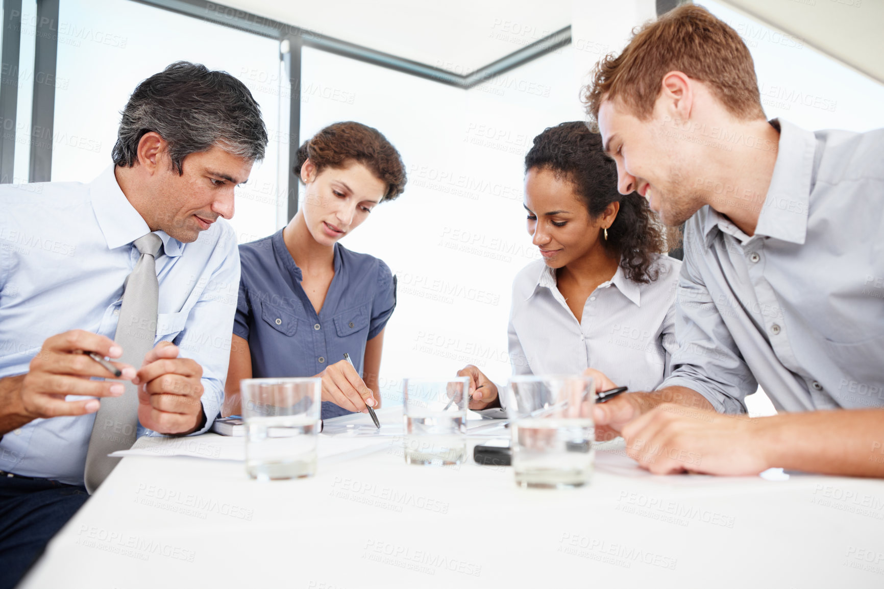 Buy stock photo Business, people and strategy in boardroom with documents for planning, teamwork and collaboration. Employees, coworking and happy with paperwork at office in meeting for brainstorming and explain