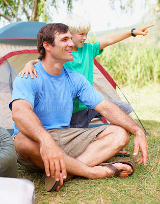 Buy stock photo Pointing, camping and father with child in nature for adventure, holiday or weekend trip. Exploring, bonding and dad with boy kid by tent in outdoor woods for vacation together in New Zealand.