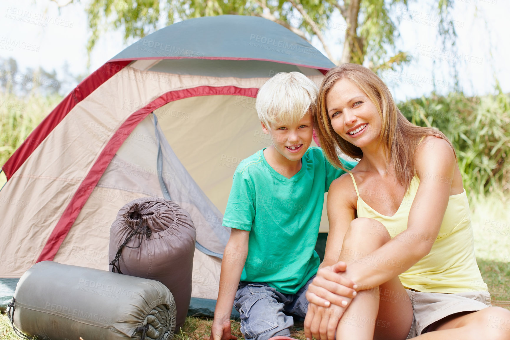 Buy stock photo Portrait of mother and son camping on a holiday and giving you a cute smile
