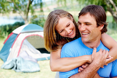 Buy stock photo Couple, relax and camping in nature for vacation, leisure and travel with tent and hug in California. People, bonding and happiness outdoor for holiday, hiking and adventure with smile by campsite 