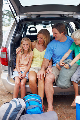 Buy stock photo Family, happy and relax by car for camping in forest or outdoor, adventure and weekend trip for break. Smile, parents and children together in nature or wilderness for summer, holiday and bonding.