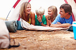 Family relaxing in tent