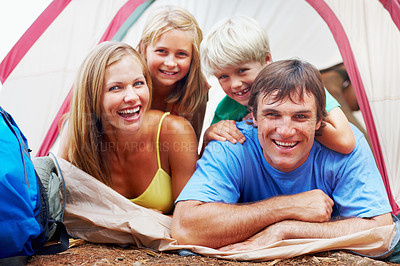 Buy stock photo Family, parents and children in tent, portrait and bonding with storytelling in woods, love and adventure. Nature, dad and mom with smile, campsite and fun of camping, woman and laughing with kids