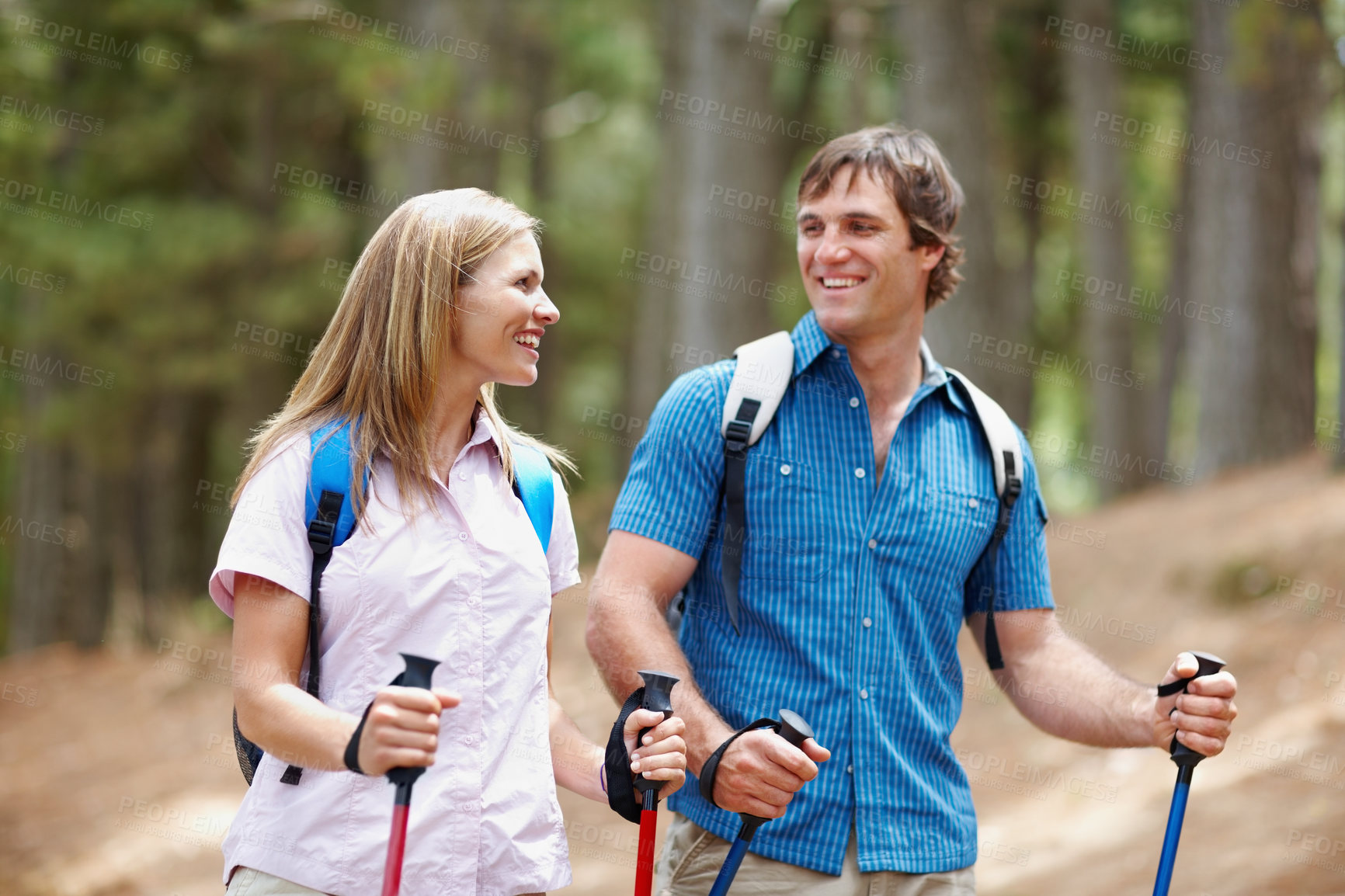 Buy stock photo Happy couple, hiking and gear with backpack, walk and nature for travel, adventure and bonding. People, journey and backpacking for discovery, fitness and exploring for recreation, outdoor and sports