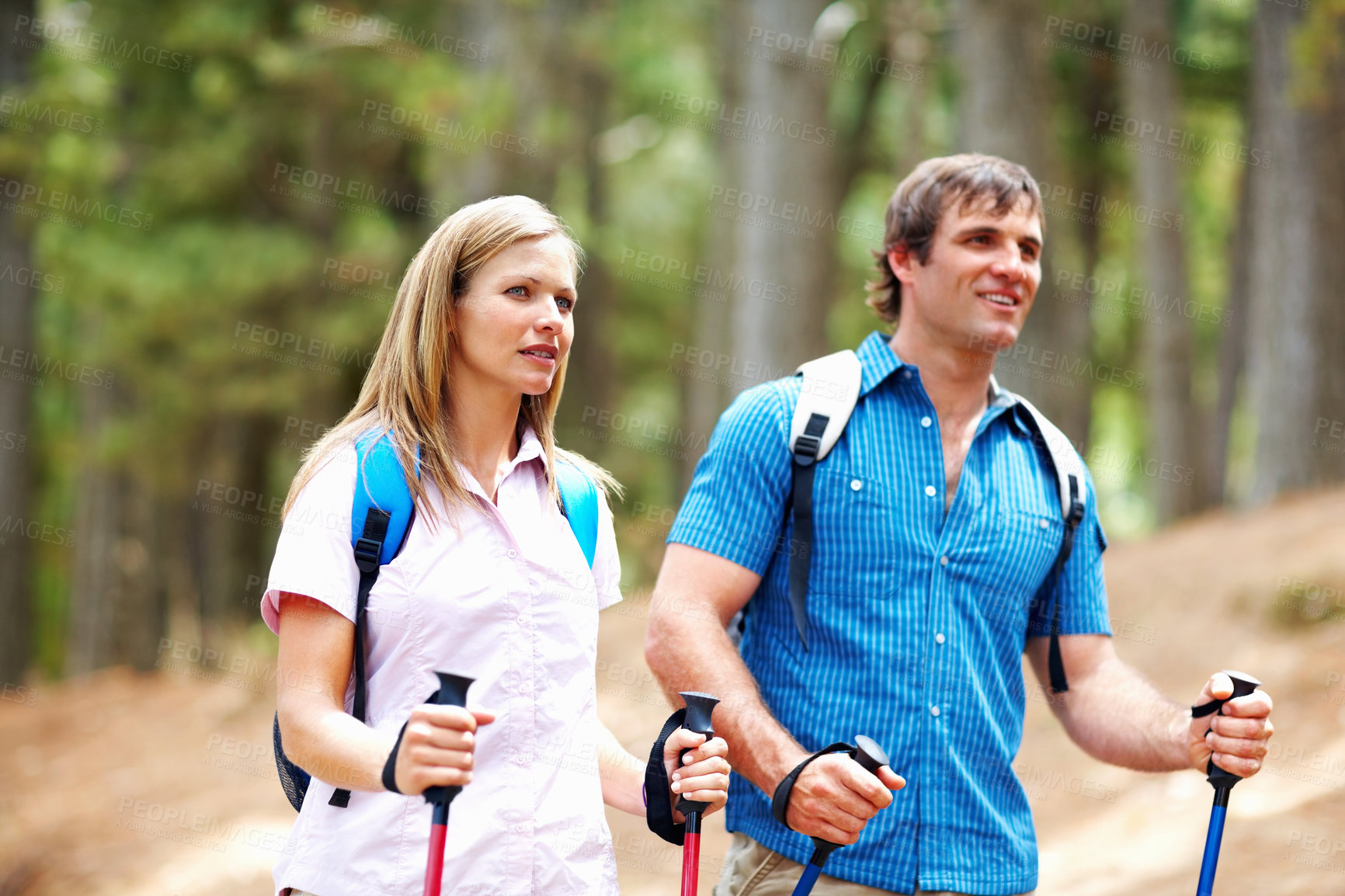 Buy stock photo Couple, hiking and walk with backpack, nature and gear for travel, adventure and forest. Happy people, journey and backpacking for discovery, fitness and exploring for recreation trekking outdoor