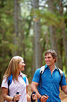 Couple walking with hiking poles