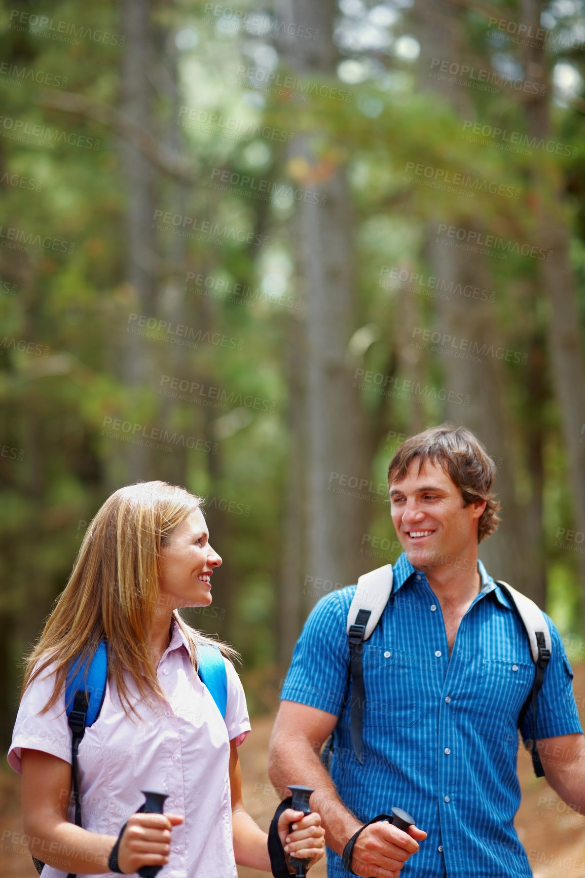 Buy stock photo Happy couple, hiking and outdoor with backpack, walk and nature for travel, adventure and bonding. People, journey and countryside for discovery, fitness and exploring for recreation, gear and trek