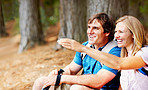 Couple taking a break from hiking and looking away