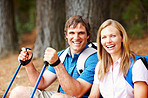 Couple taking a break from trekking and smiling