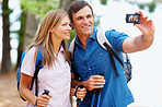 Couple taking photo while hiking