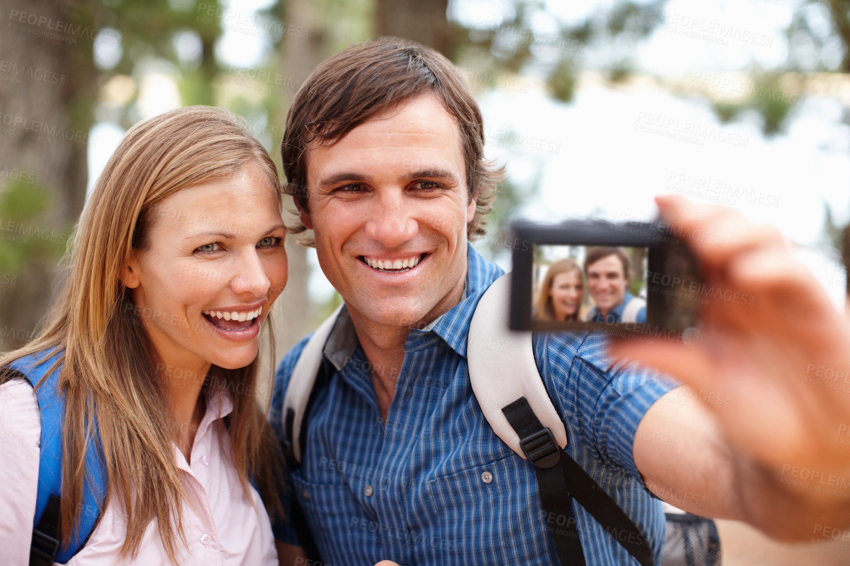 Buy stock photo Nature, couple and trekking with camera for selfie, photography and document memory for hiking in Sweden. Outdoor, woman and man as photographer with equipment, pov picture and bonding on adventure