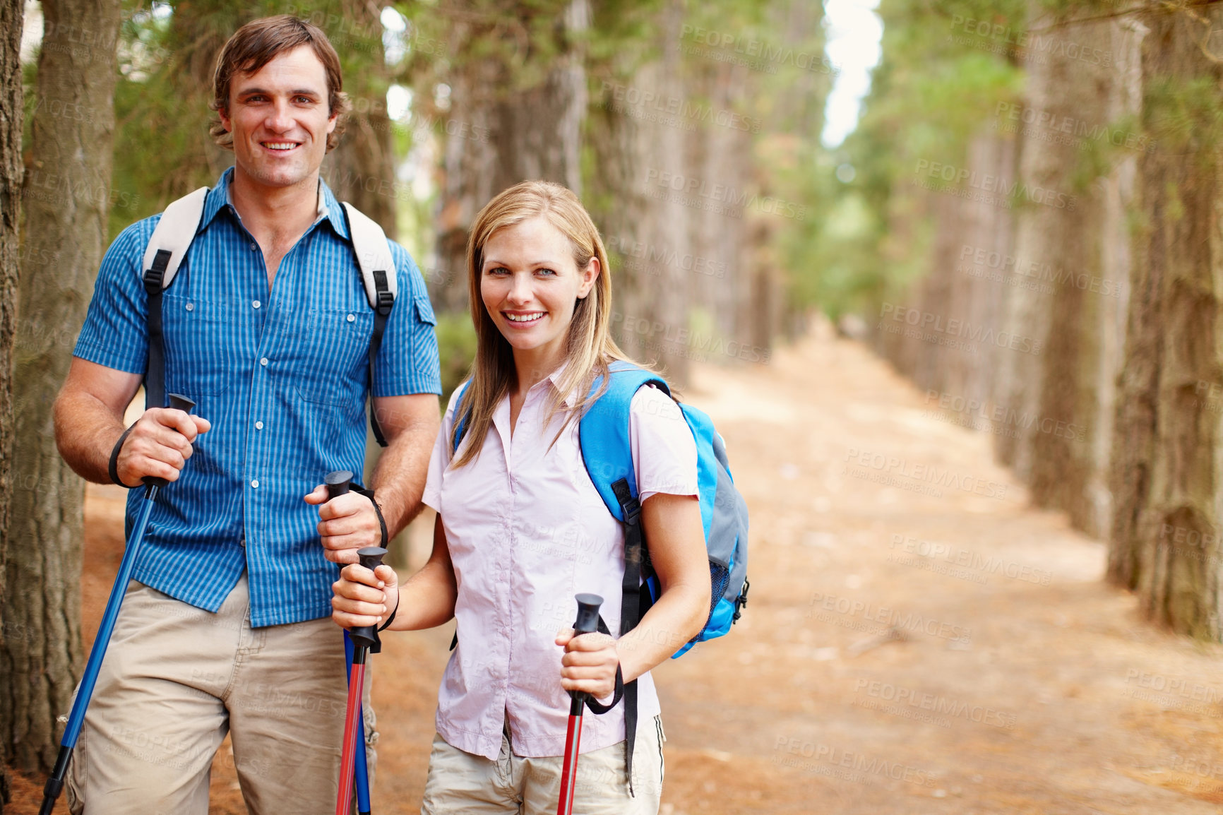 Buy stock photo Portrait, hiking and couple with nature, woods and fitness with happiness, adventure and love. Face, forest and hike with man, woman and journey with poles, hobby and balance for wellness or travel