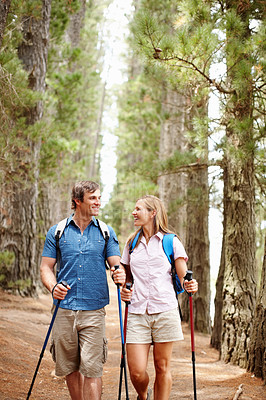 Buy stock photo Happy couple, hiking and gear with countryside, walk and nature for travel, adventure and bonding. People, journey and backpack for discovery, fitness and exploring for recreation, outdoor and sports