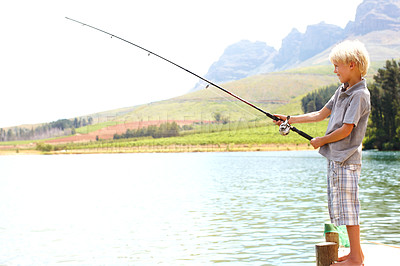 Buy stock photo Relax, boy and fishing by lake for learning, vacation and travel in summer with gear on dock by water. Kid, fun and catch fish in nature for adventure, holiday and development while camping with line