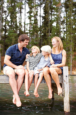 Buy stock photo Bonding, family and outdoor in nature, lake and holiday for parents and children, vacation and fun. Water, mom and dad with kids, happy and travel to river for peace, man and woman with smile