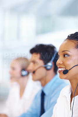 Buy stock photo Portrait of pretty African American operator with colleagues on call