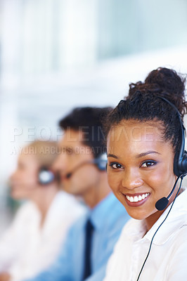 Buy stock photo Portrait of smiling African American female representative with colleagues on call