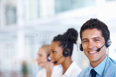 Buy stock photo Portrait of smart male operator on call with female colleagues