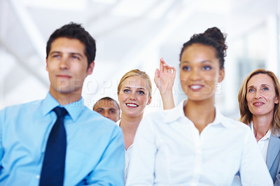 Buy stock photo Portrait of business woman raising her hand to ask question during seminar