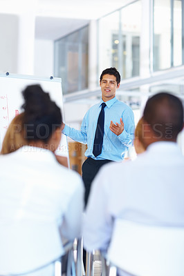 Buy stock photo Portrait of young business man giving presentation at meeting