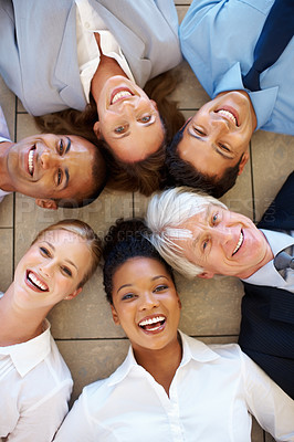 Buy stock photo Top view of multi racial business team lying together