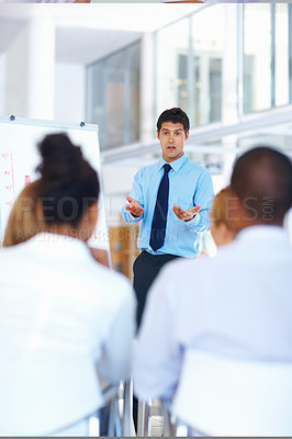 Buy stock photo Low angle view of multi ethnic business team smiling head to head