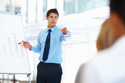 Buy stock photo Portrait of handsome executive giving presentation to business team