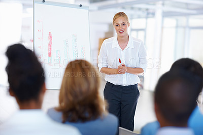 Buy stock photo Portrait of successful female executive giving presentation to business group