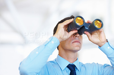 Buy stock photo Portrait of handsome business man looking through binoculars