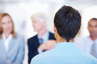 Buy stock photo Rear view of young applicant getting interviewed by panel