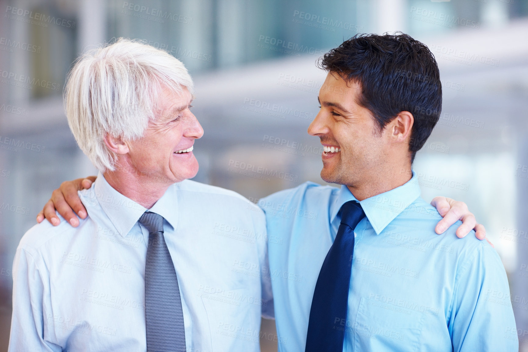 Buy stock photo Portrait of happy male executives looking at each other in office