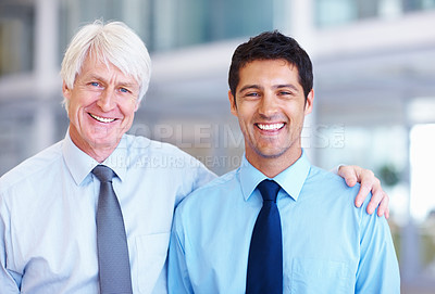 Buy stock photo Portrait of friendly male executives smiling together at office
