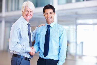 Buy stock photo Portrait of successful business men shaking hands with each other