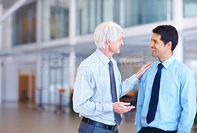 Buy stock photo Portrait of senior executive guiding young business man at office