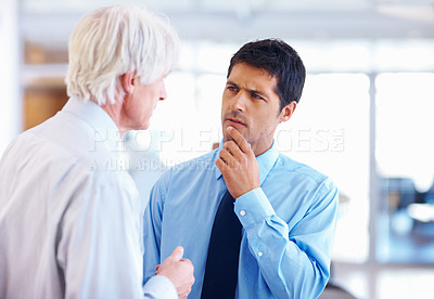 Buy stock photo Portrait of doubtful business man listening to senior executive at office